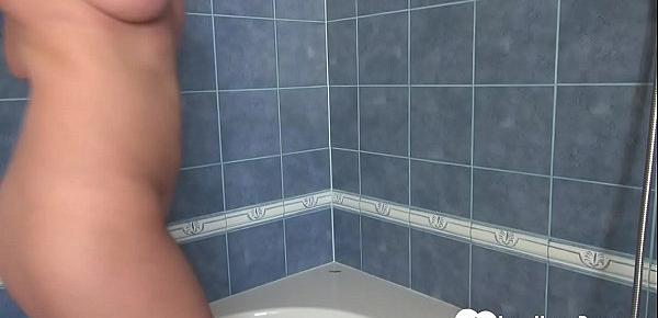  Busty MILF in the shower loves to trim herself